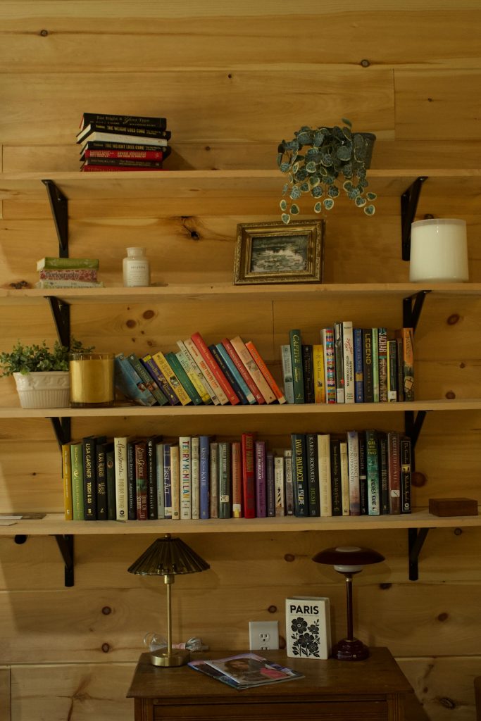 Bookshelves and a reading lamp in the cafe at Cafe Pilates